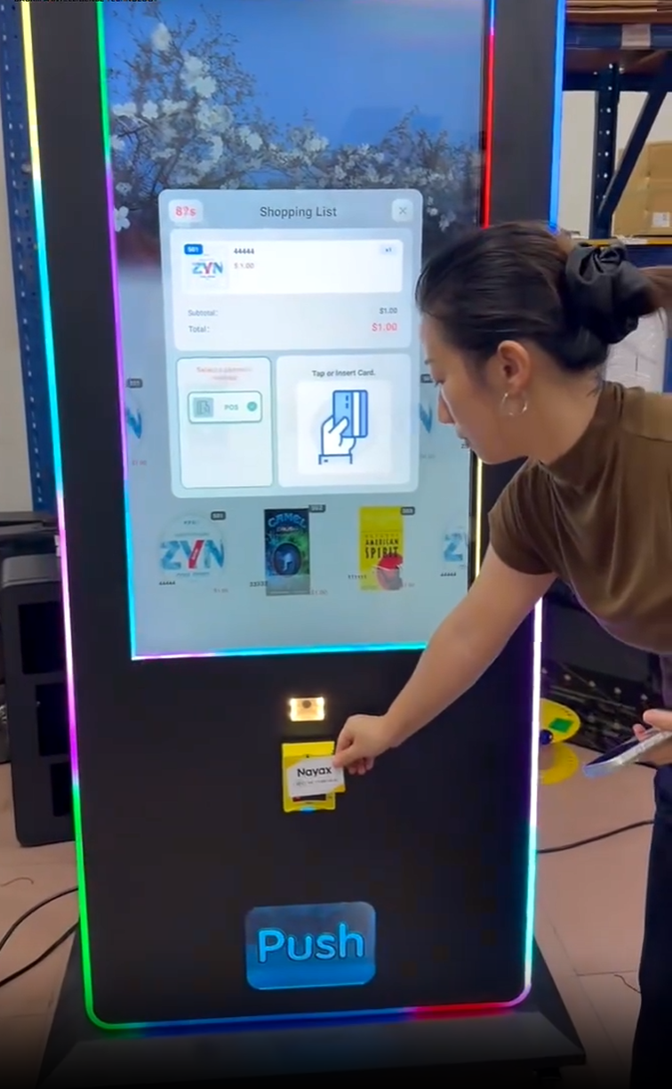 Customer using card reader on 43-Inch HQ Smart Vending Tower
